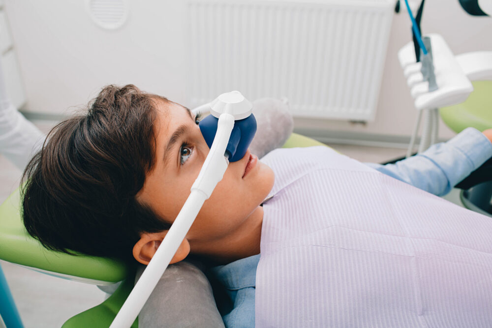 Child receiving gentle pediatric dental treatment in Greater St. Louis.