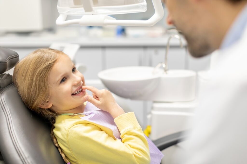 Young patient smiling during a pediatric dental appointment in Greater St. Louis.