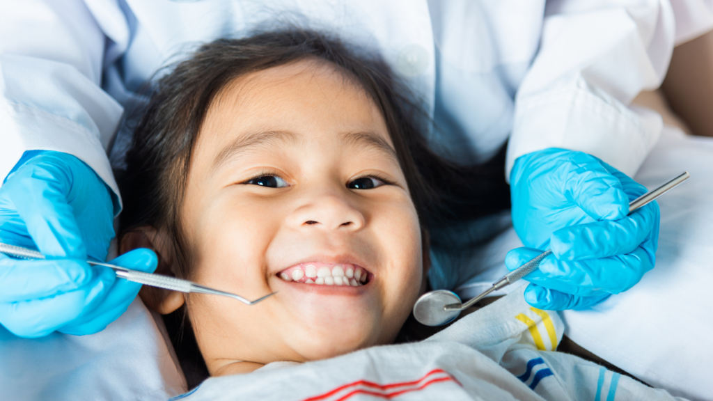 Girl smiling while getting fluoride treatment in Greater St Louis